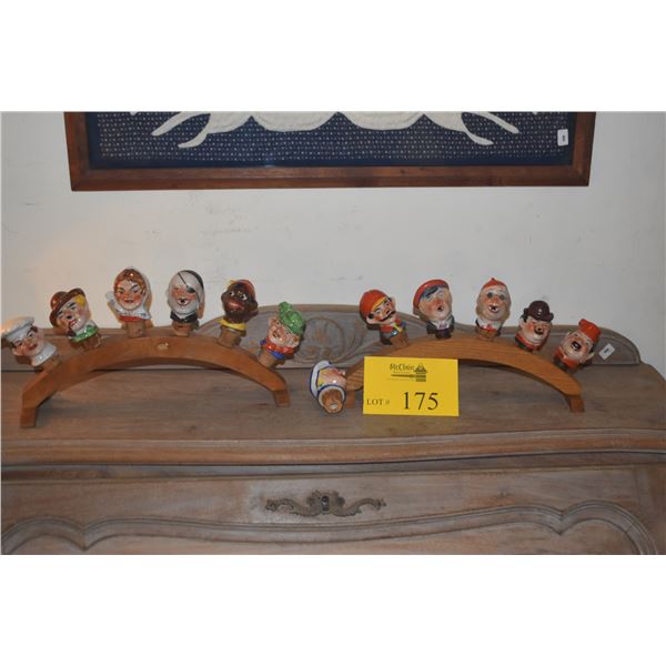 VINTAGE GERMAN PORCELAIN FIGURAL WINE BOTTLE STOPPERS ON WOODEN DISPLAY RACKS (14 PCS)
