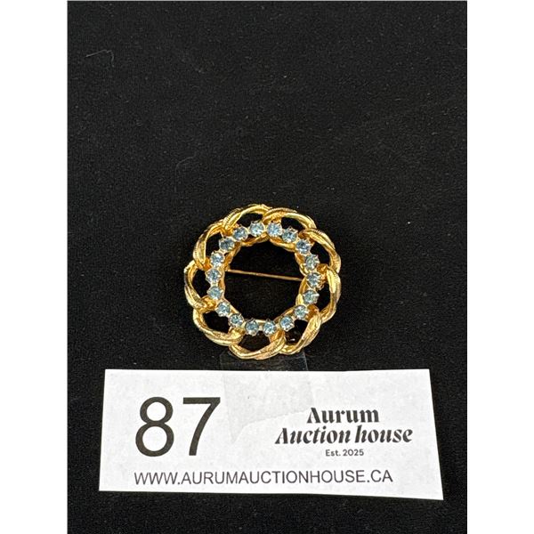 1960s-70s Vintage Blue Rhinestone Curb LMK Circle Brooch Textured Gold Tone