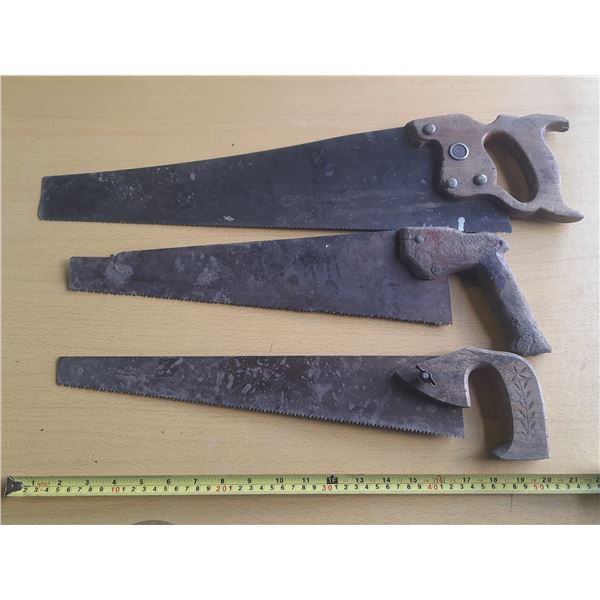 (3) Vintage hand saws.