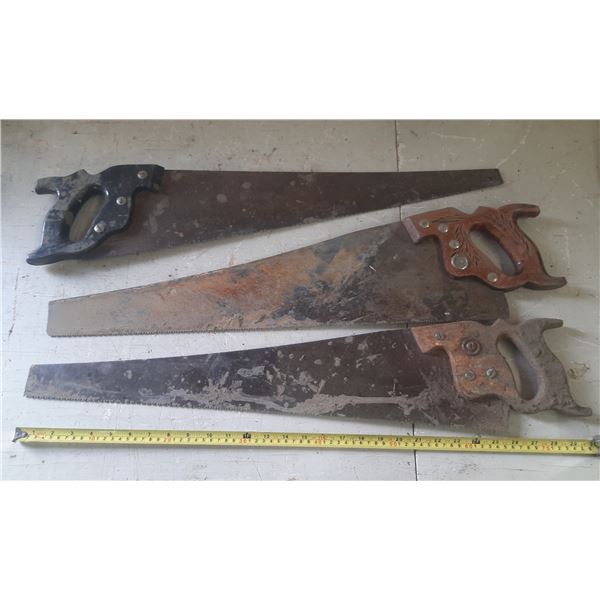 (3) Vintage hand saws.