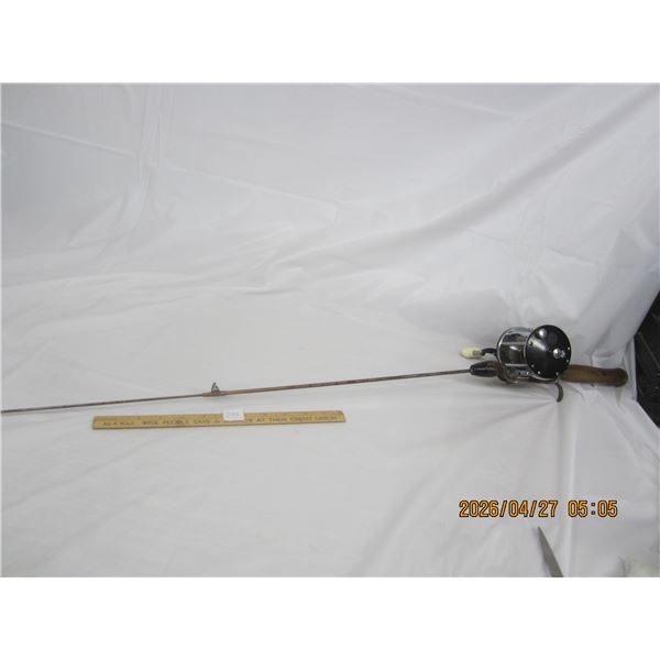299. Antique Steel Fishing Rod with a Penn Lifeline