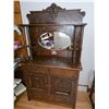 Image 1 : Wooden display cabinet with bevelled mirror back. Drawers and doors for storage area open.- 40.5" by