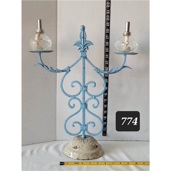 Scrolled wrought iron candle holder with ceramic base & oil candles. Fleur de lis.
