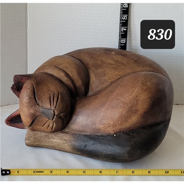 Large, heavy solid wood curled up cat.