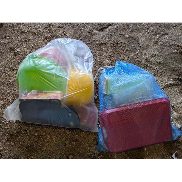 (2) Bags full of Misc. Tupperware and Tins and etc. As Shown
