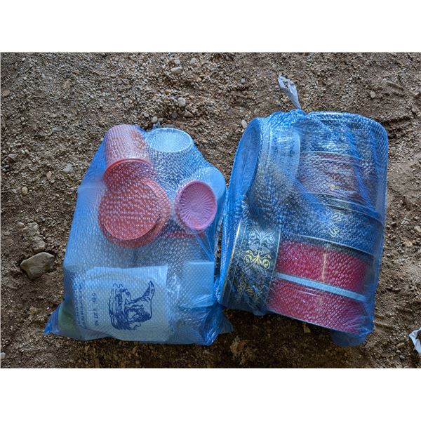 (2) Bags full of Misc. Tupperware and Tins and etc. As Shown