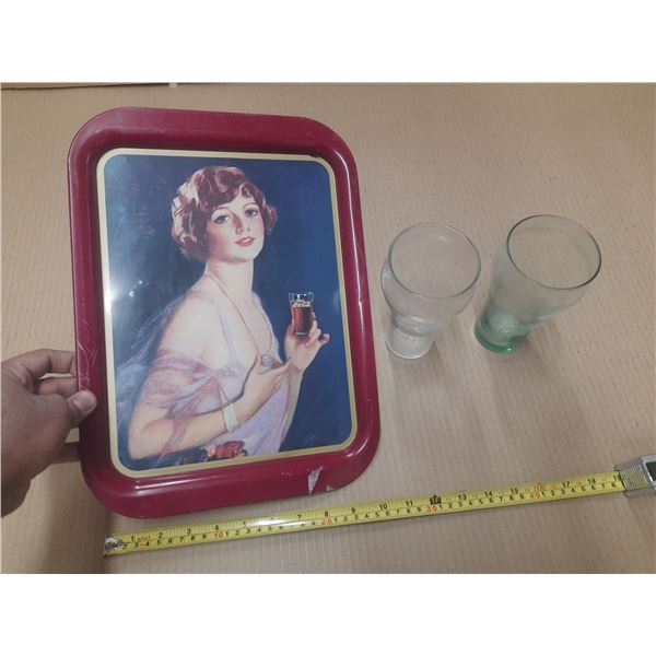Vintage metal serving tray is a Coca-Cola collectible featuring a "Calendar Girl" and Coca-Cola Glas
