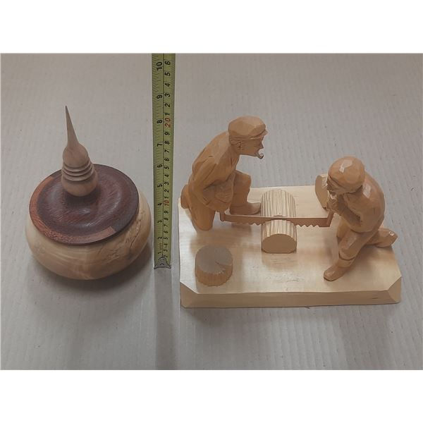 Vintage Swedish wood-carved figurines depicting a sawyer scene and wooden bowl with a decorative fin