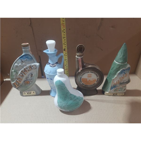 Collection of vintage ceramic Jim Beam whiskey decanters.