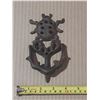 Image 1 : Vintage Cast iron door knocker featuring an ornate beetle or ladybug motif.