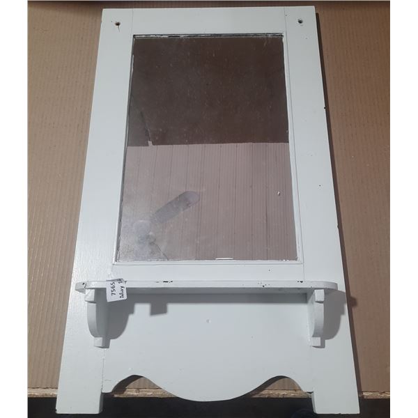 White wall-mounted mirror. (29" X 17")
