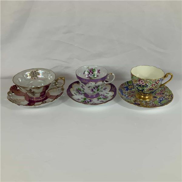 Three Porcelain Teacup and Saucer Sets Including Shelley Paisley and Heinrich and Co.