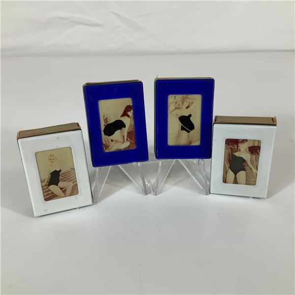 A Set of Four Vintage Mechanical Pin-Up Magic Matchboxes