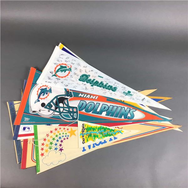 A Collection of Vintage and Commemorative Sports Pennants and Souvenir Flags including Miami Dolphin