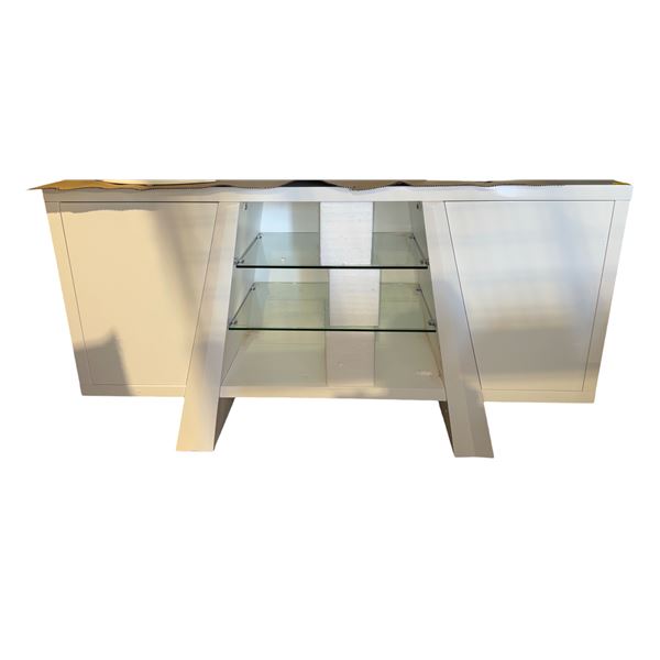 Contemporary white sideboard with push open doors and glass shelves