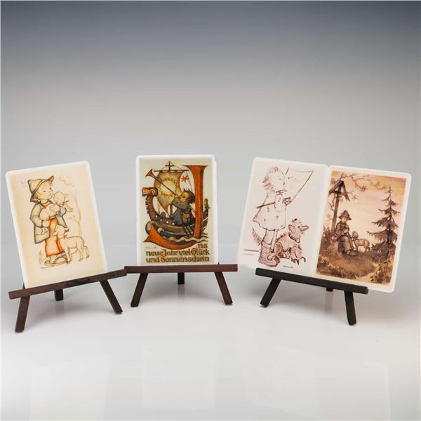 A Set of Four Goebel M.I. Hummel Porcelain Postcard Plaques
