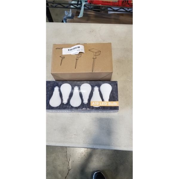 NEW 4 PACK OF SOLAR GARDEN LPATH LIGHTS AND POACK OF NEW A19 LED BULBS