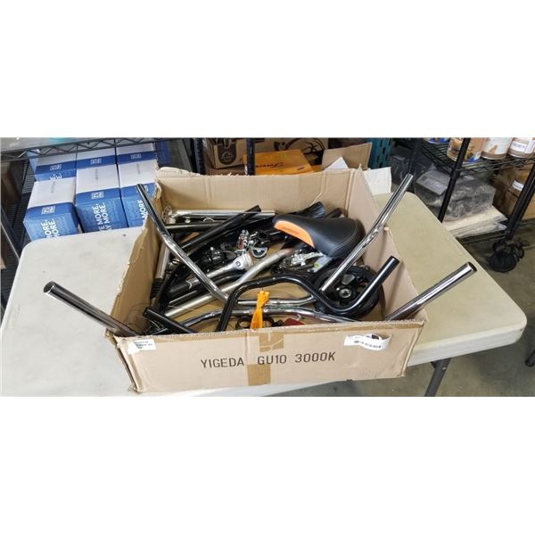 BOX OF NEW BIKE PARTS - SEATS, HANDLE BARS, REFLECTORS, ETC