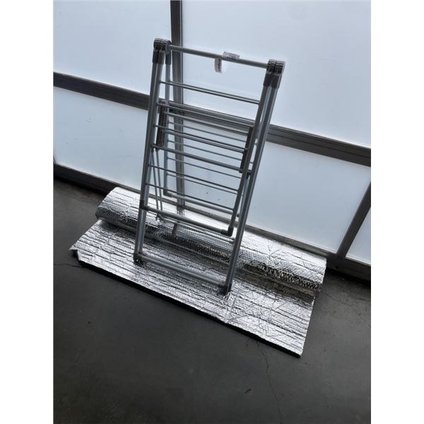ROLL OF INSULATION AND FOLDING CLOTHES DRYING RACK