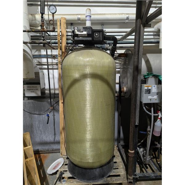 CHARCOAL WATER FILTER. TANK IS 6' TALL X 28" DIAMETER. 2" FEED. TIMER CONTROL