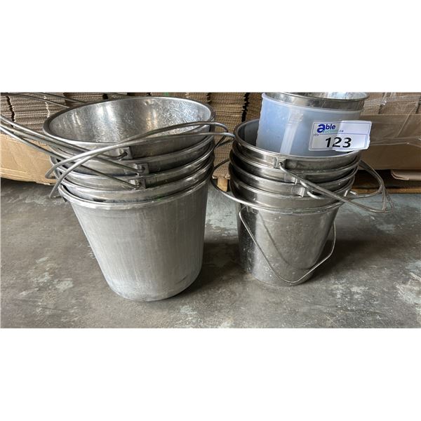 STACK OF METAL BUCKETS AND 1 PLASTIC VESSEL. APPROX 11 PIECES