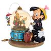 Image 1 : A  "Pinocchio " Snow Globe with Accessories.