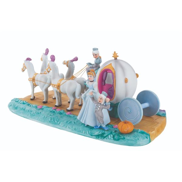 A  "Cinderella " Figurine with Pumpkin Coach.