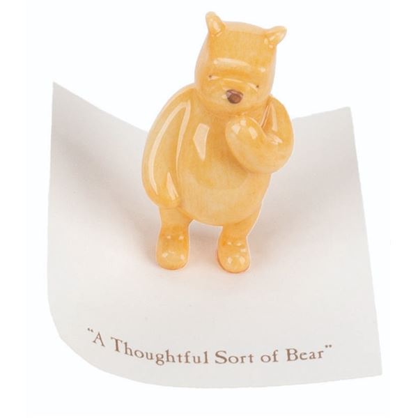 A Michel and Co. Winnie the Pooh Mini Figure.