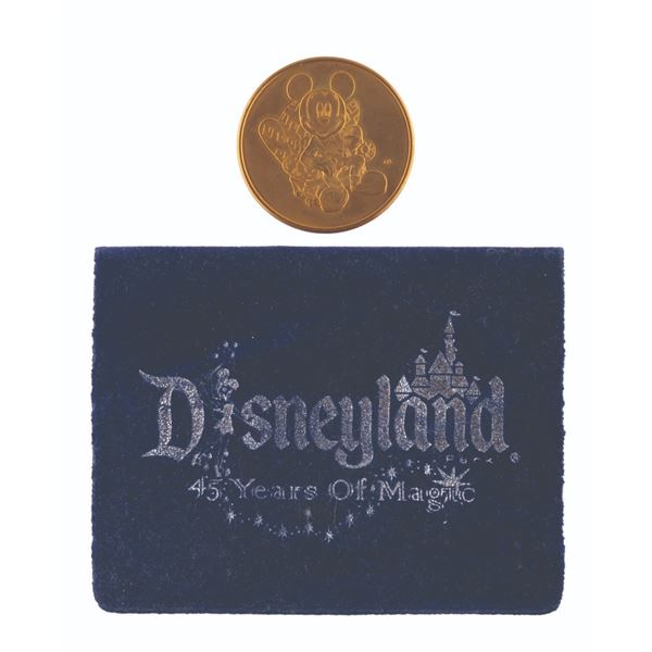 A Disneyland 45th Anniversary Mickey Mouse Coin.
