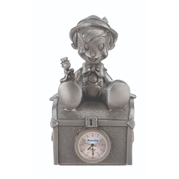 A Pewter Pinocchio Desk Clock.