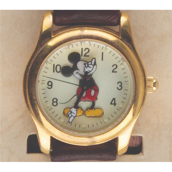 A Mickey Mouse Watch and Tin.