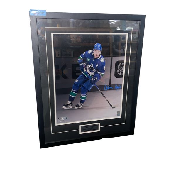 Framed Autographed Quinn Hughes Vancouver Canucks Photo, H28.5" x W23"