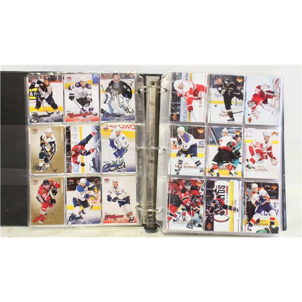 COLLECTOR BINDER FULL OF SPORTS CARDS