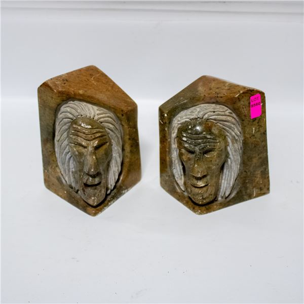 PAIR OF CARVED SOAPSTONE FIRST NATIONS FACES BOOK