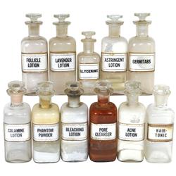 Apothecary bottles (11), all label under glass for cosmetic products, Pore Cleanser has crack, other
