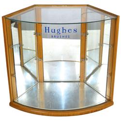 Hughes Brushes showcase with curved glass front, needs shelves, o/wise VG cond, 16"H x 18"W.