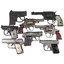 Toy cap guns (8), all cast iron, Stevens Spit Fire w/airplanes on grips, National, Stevens 25-50, Ki