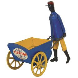 Toy, Tip Top, mfgd by Strauss, Black man pushing cart, litho on tin windup, works but doesn't want t