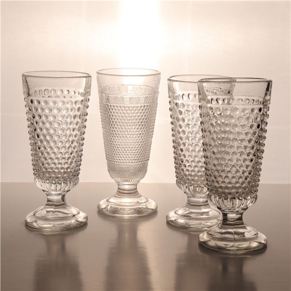 Four Molded Glass Footed Drinking Mugs