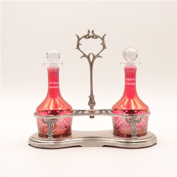 Art Nouveau cranberry glass double cruet set with silverplate stand