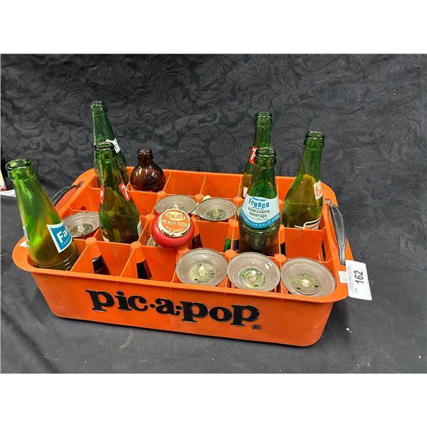 Collection of vintage 7UP and Fanta bottles with door knob