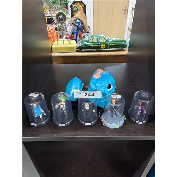 5 "horror" figurines in display cases and vintage slinky toy