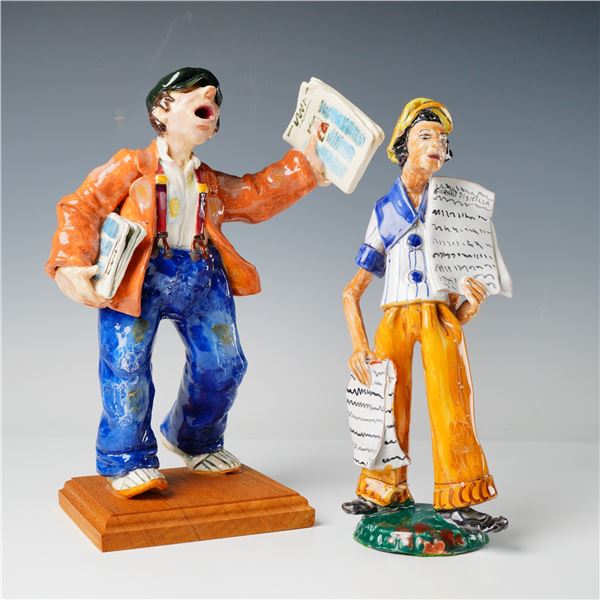 A Pair of Ceramic Newsboy Figurines