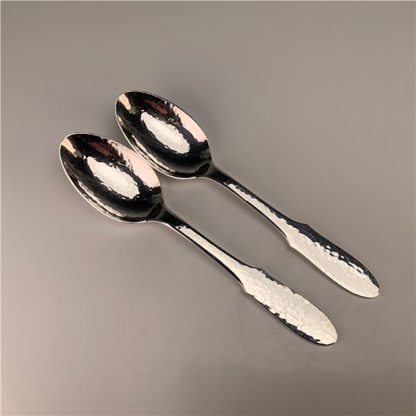 A Pair of Georg Jensen Mermaid Pattern Hammered Silver-Plated Teaspoons