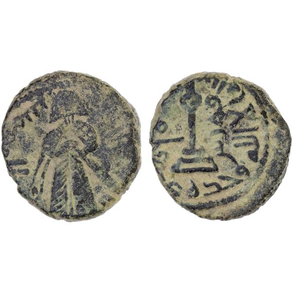 ARAB-BYZANTINE: Standing Caliph, ca. 692-697, AE fals (3.64g), Qûrus, VF