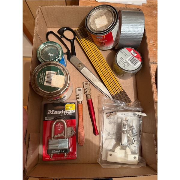 Lock with key measuring stick, scissors, duct, tape, etc.