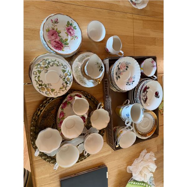 Tray, teacups cream and sugar and assorted saucers