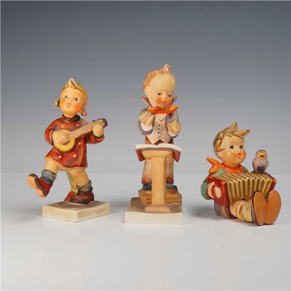 Goebel Hummel Three-Piece Musician Figurine Set, Band Leader 129, Let's Sing 110, and Accordion Boy 