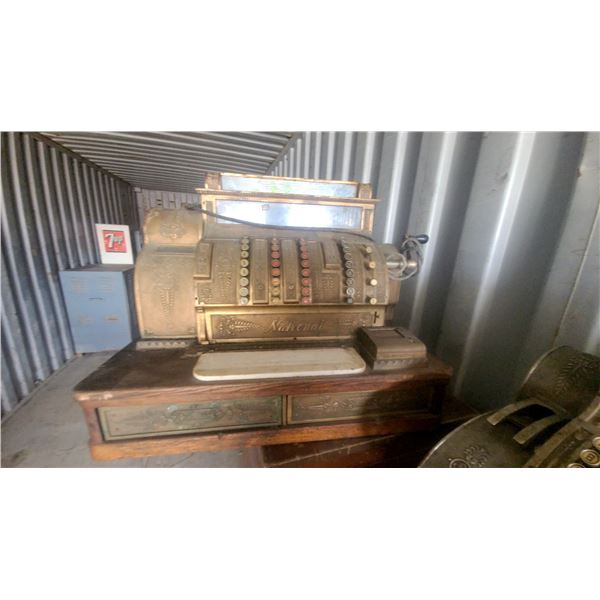 National Brass Cash Register with Ornate Embossed Cabinet and Wood Base Modle 522 L2