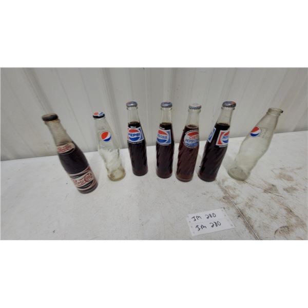 Collection of Vintage Pepsi-Cola Glass Bottles with Various Logo Designs and More
